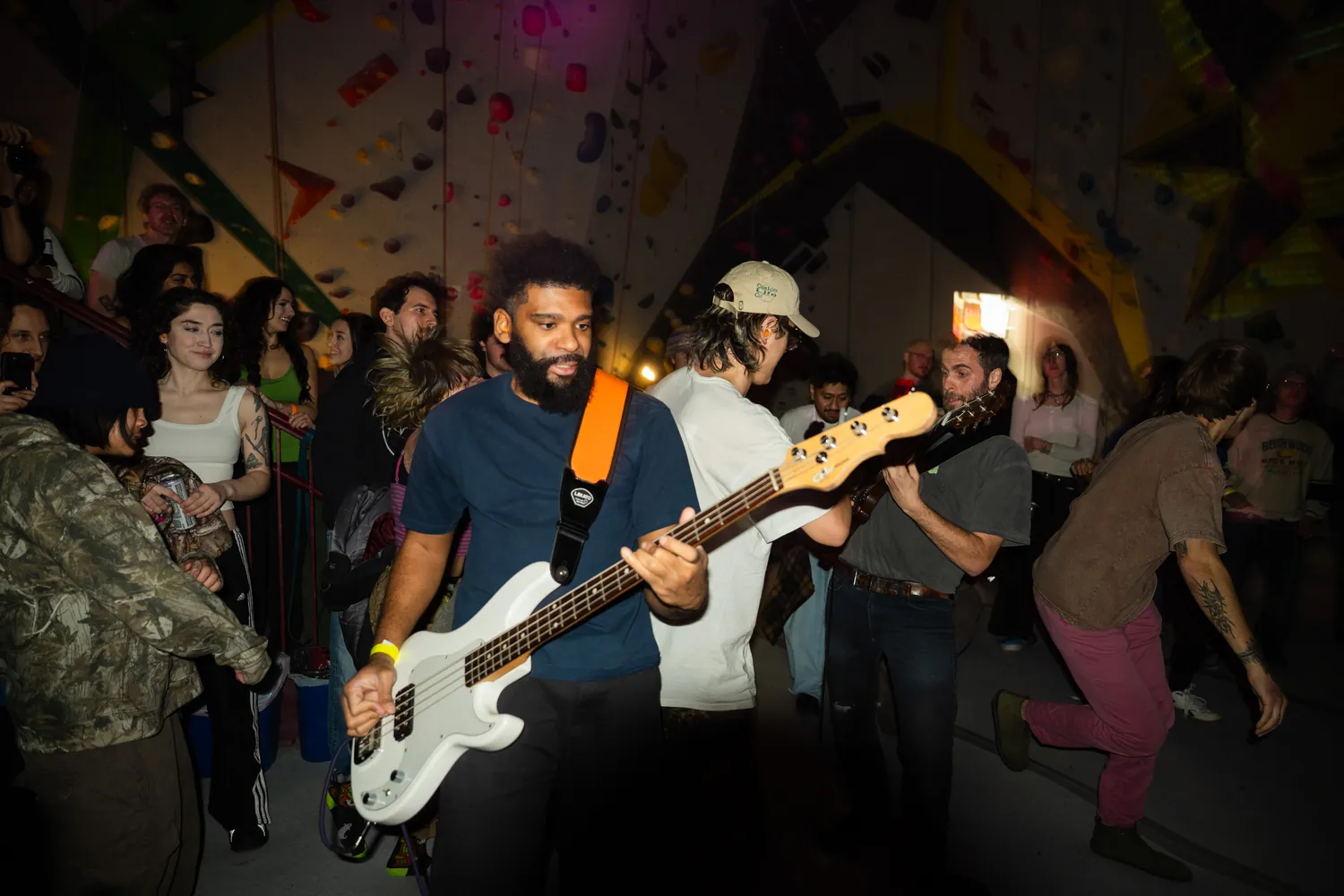 Band performing among the crowd at Vol. 2